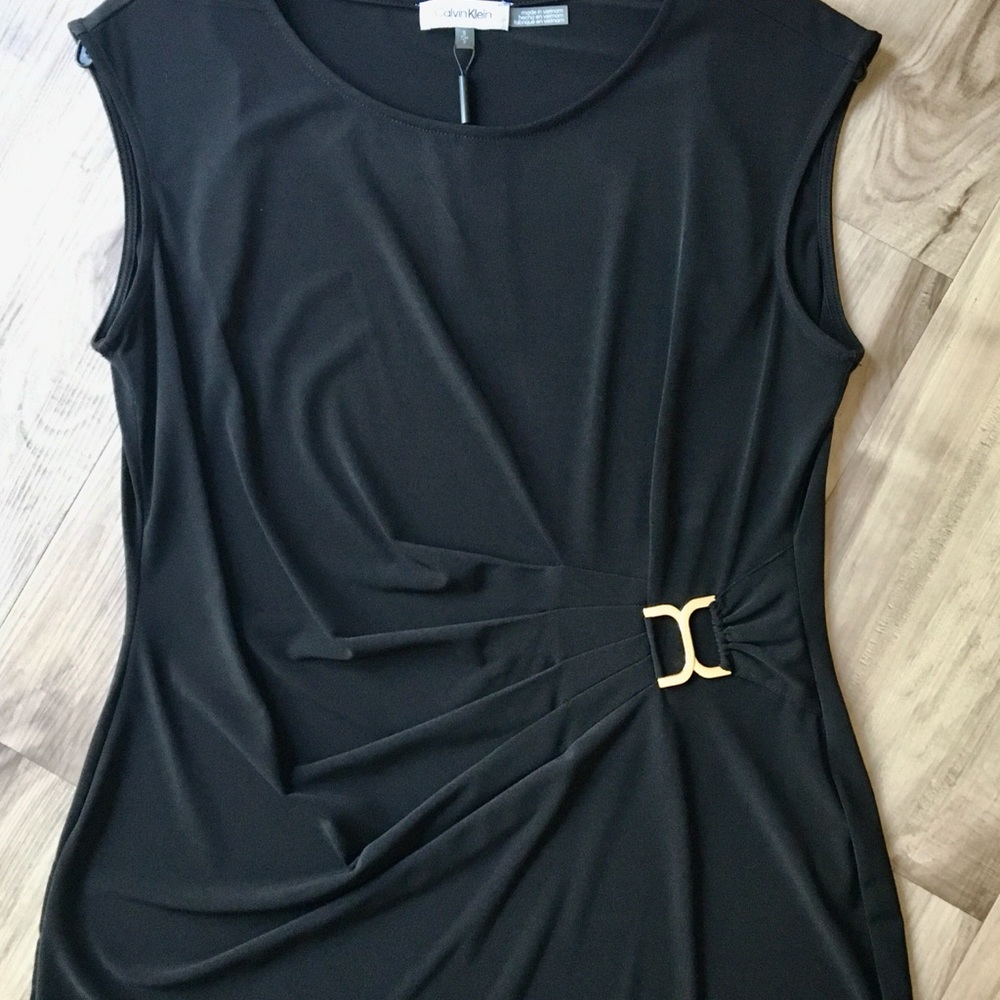 Calvin Klein sleeveless crew neck top side buckle.
